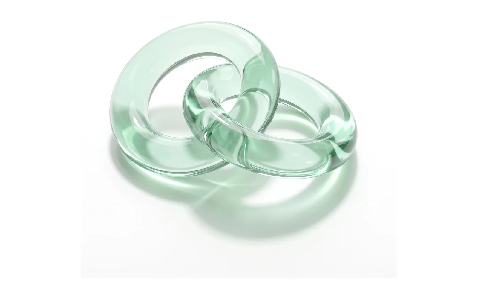 Two interlocking rings of pale green glass